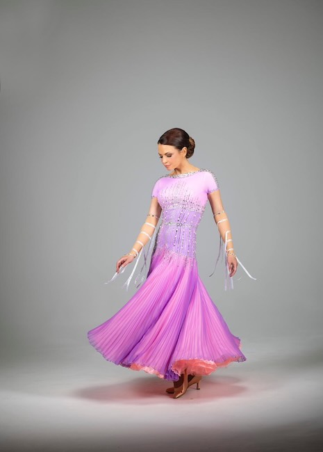 Honor Roche performing elegant ballroom dance in professional attire